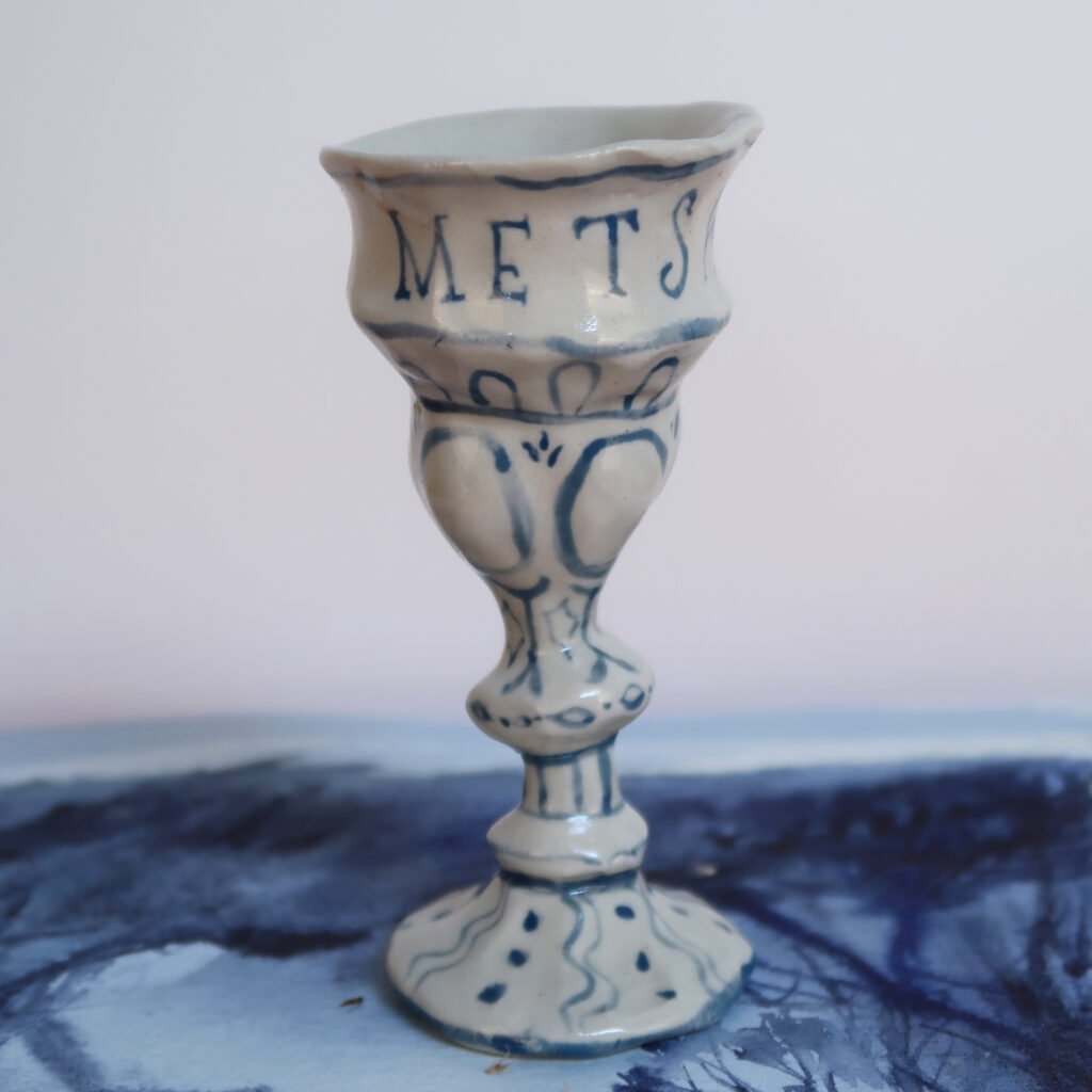 small handbuilt blue and white ceramic chalice