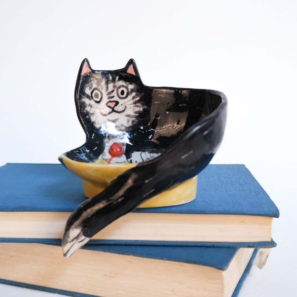 self-draining ceramic soap dish in the shape of a cat