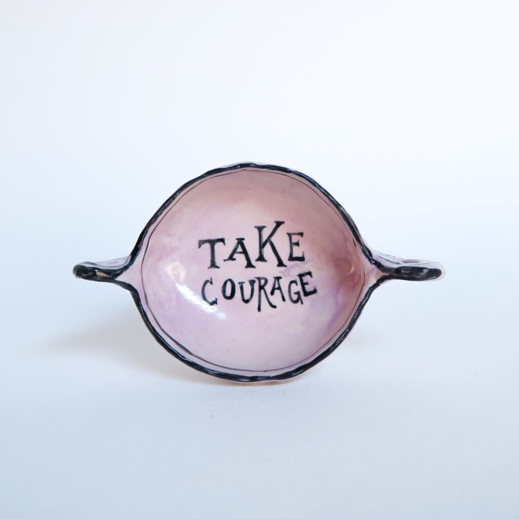 small kylix-shaped ceramic trinket dish with the words take courage