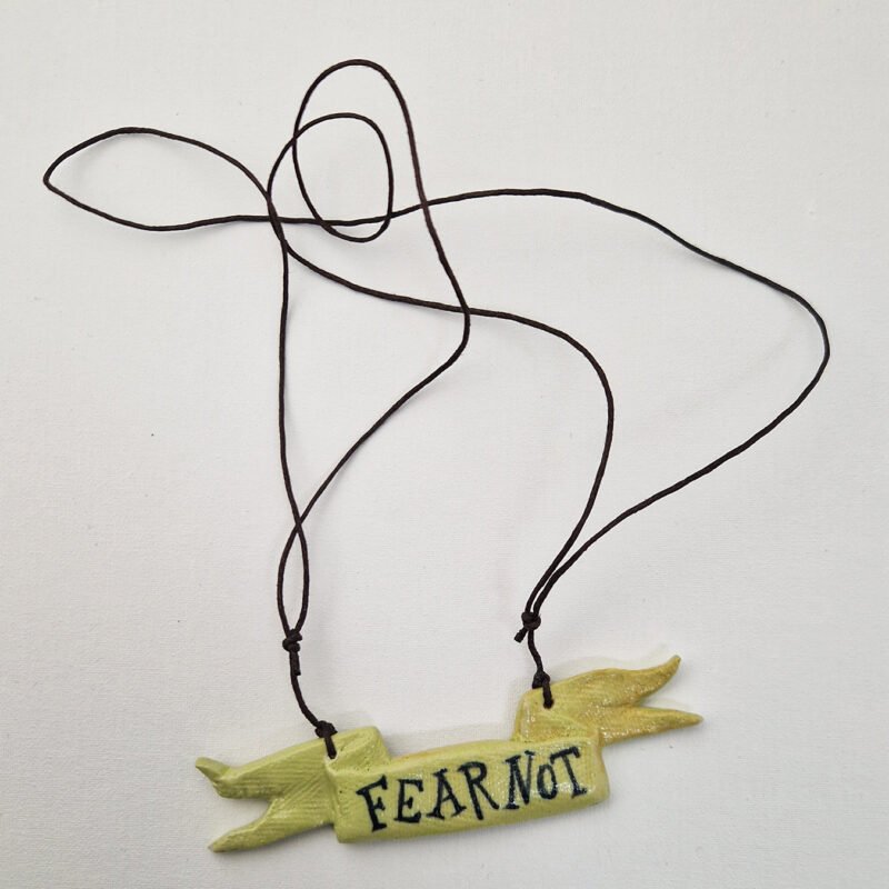 ceramic pendant with the text fear not