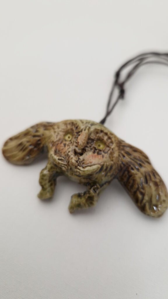 ceramic brooch/pendant of a creature