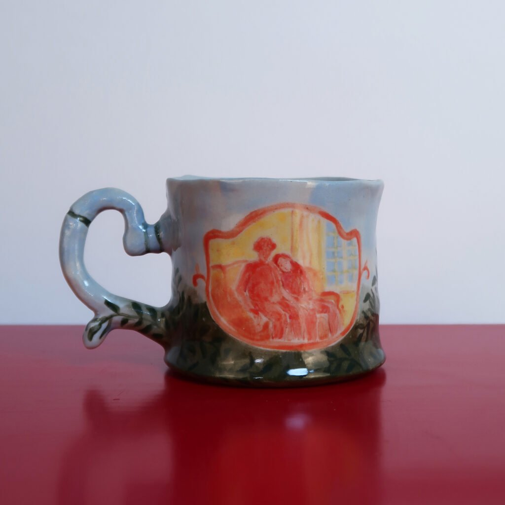 richly decorated handmade ceramic mug