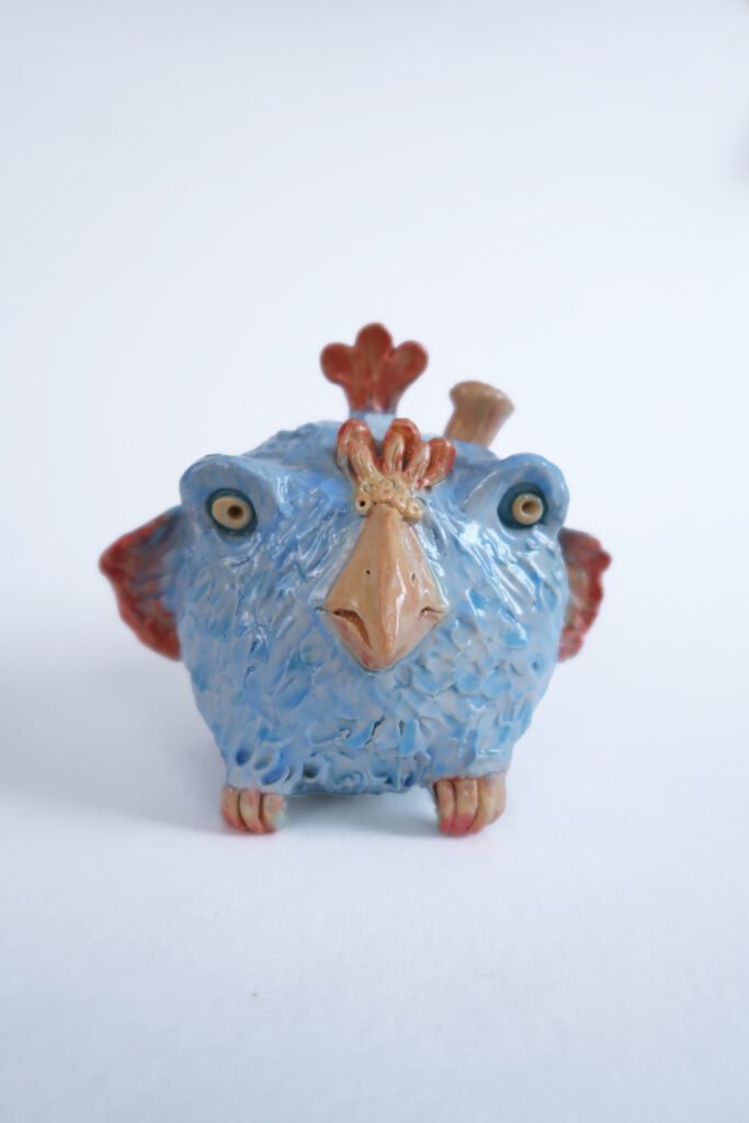 photo of a mythical ceramic bird-creature
