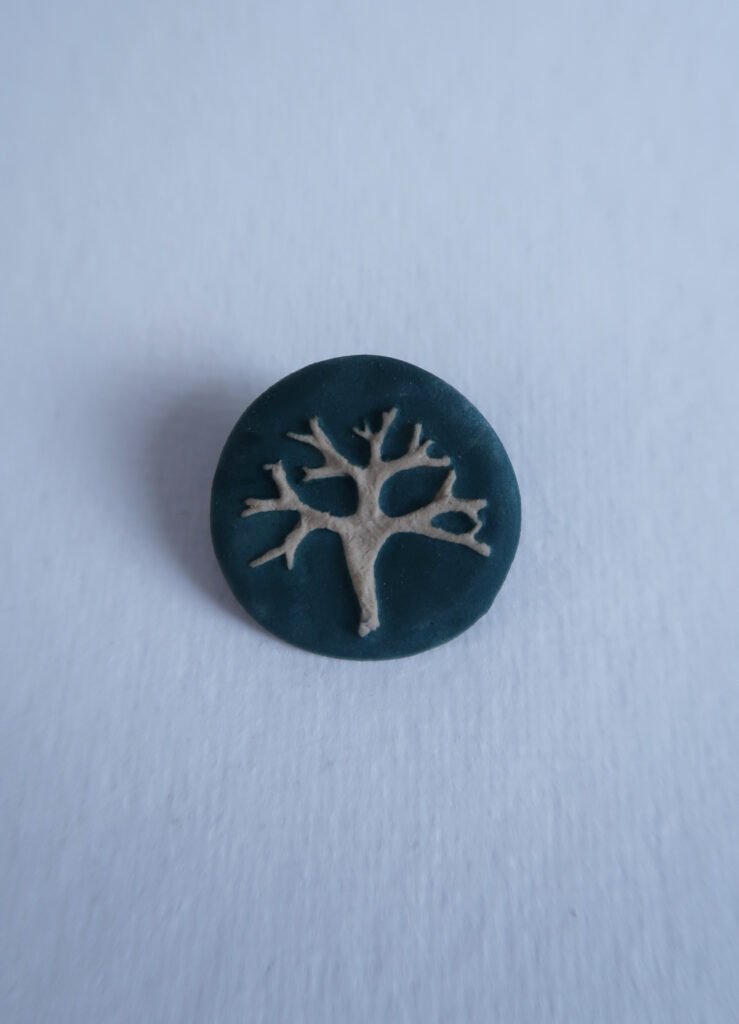 ceramic brooch with a lichen