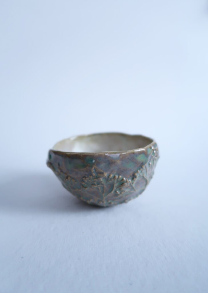 small ceramic salt cellar with the relief of rowan tree buds