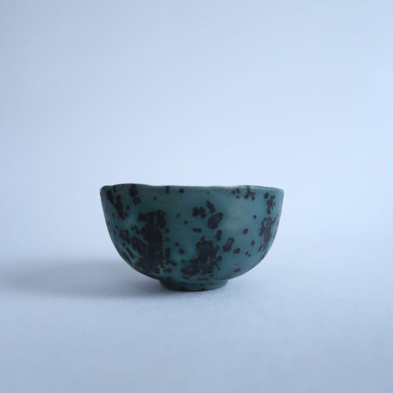 photo of a small tea bowl glazed like a blue moon