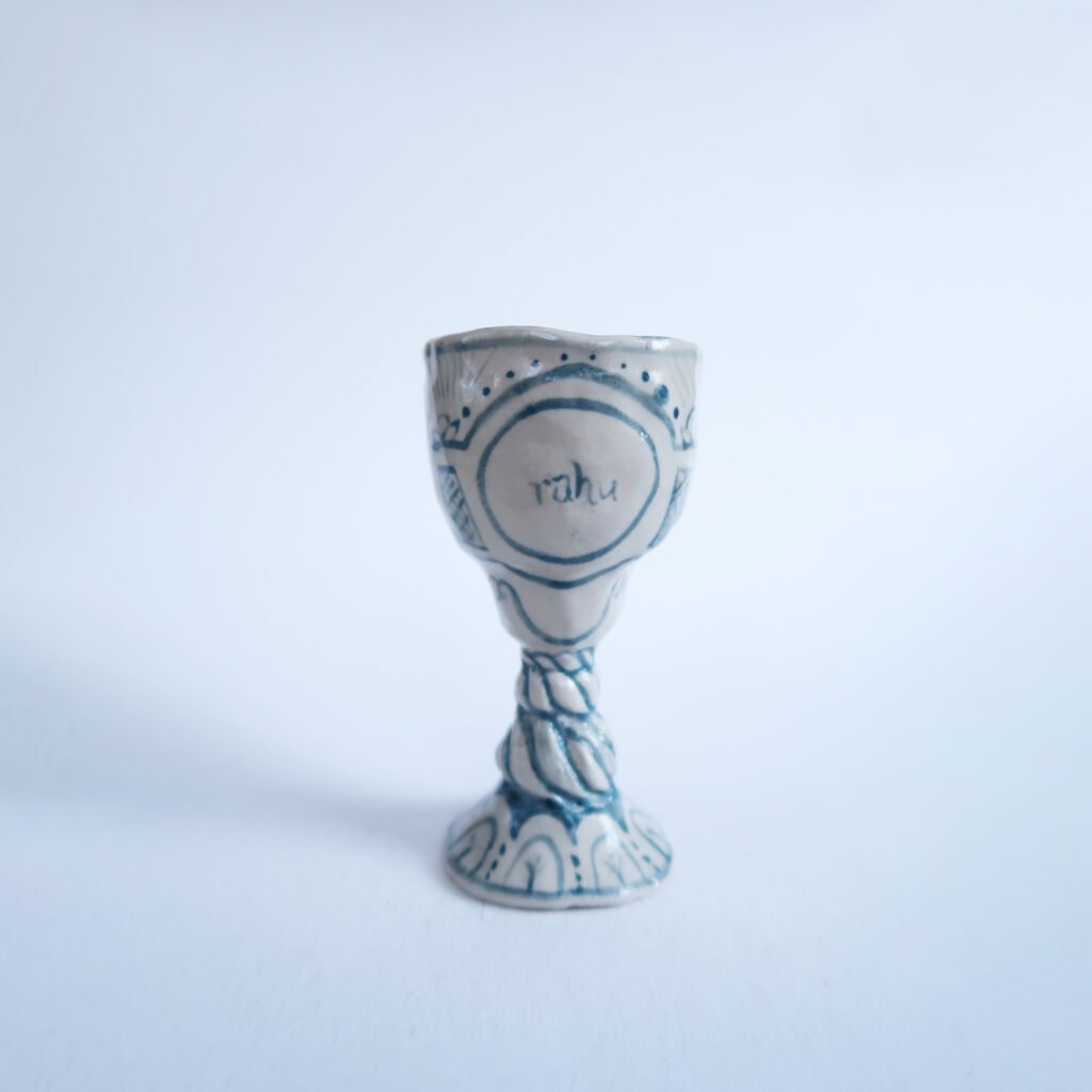 a tiny ceramic goblet