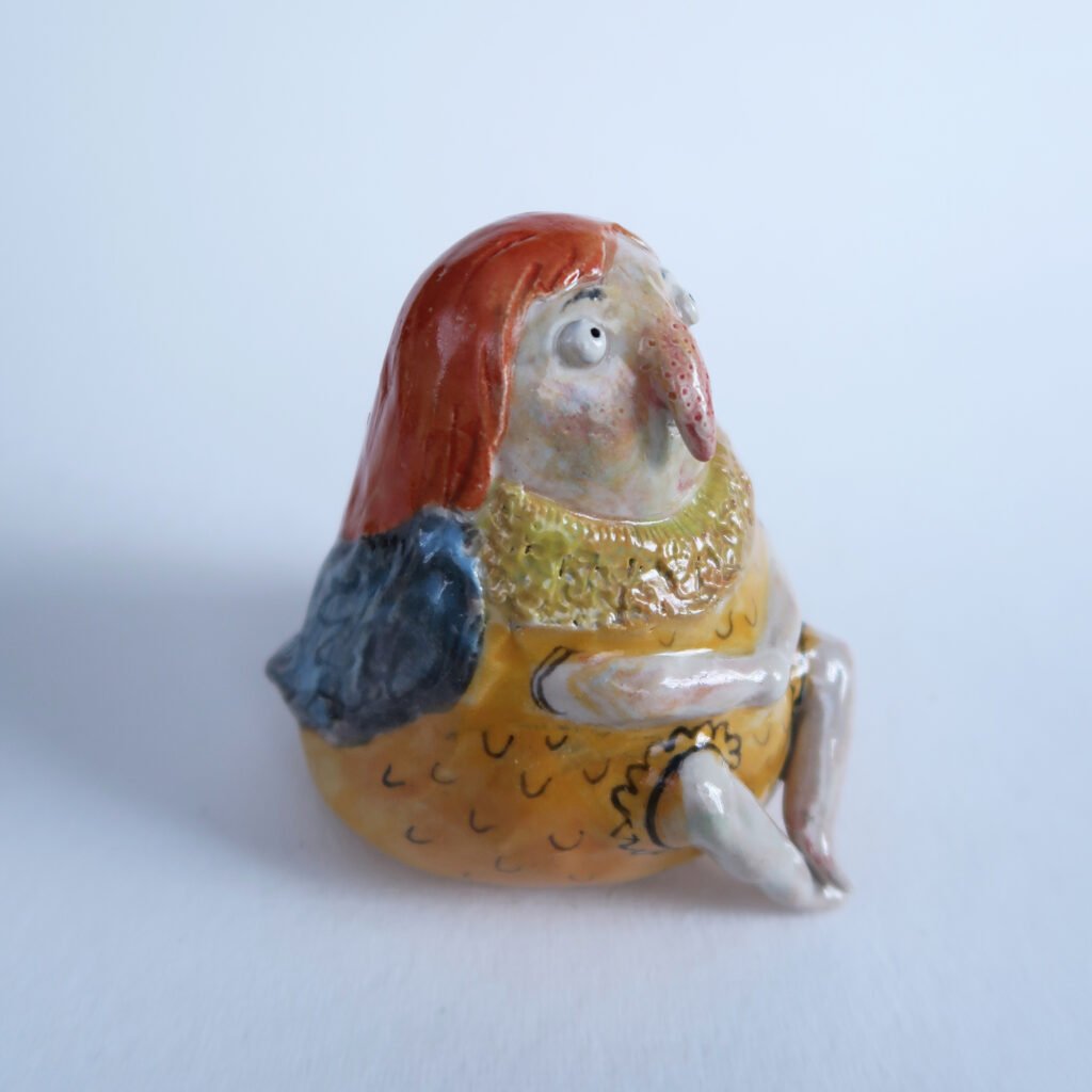 photo of a ceramic bird girl